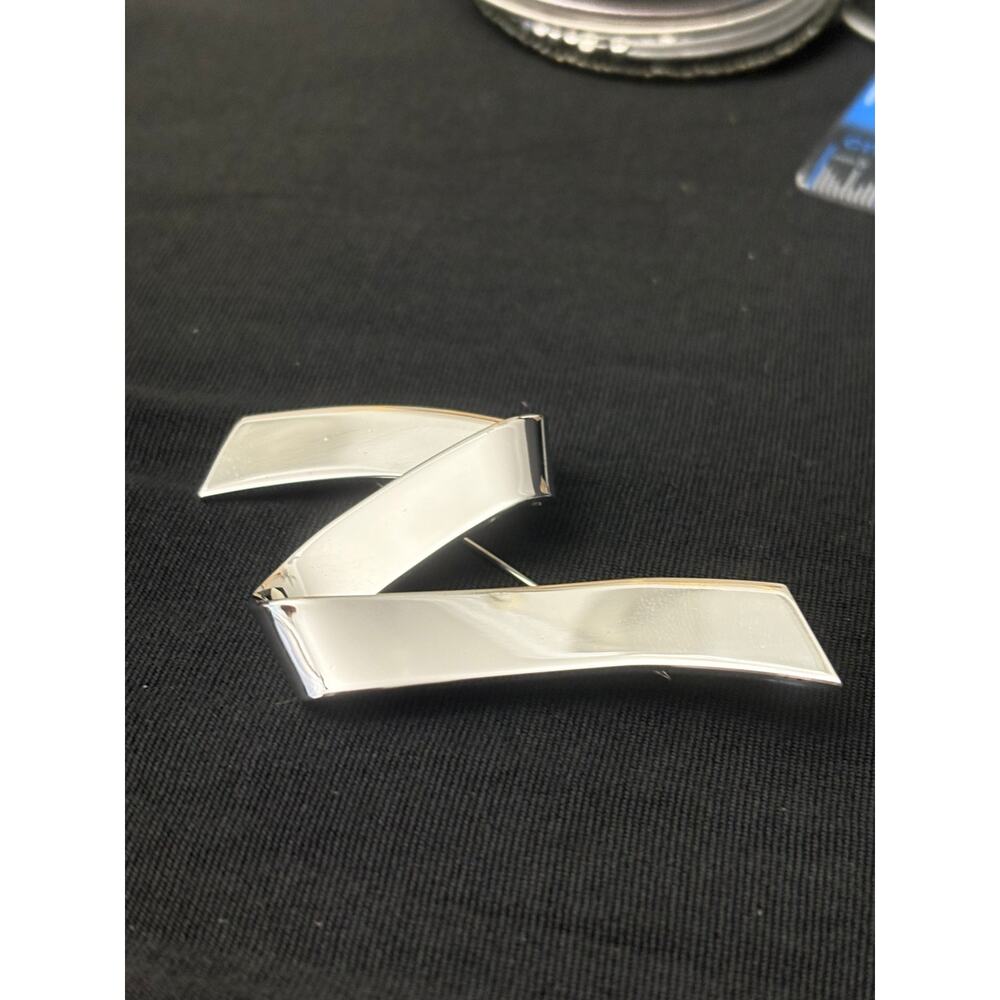 Vintage Monet Silver Tone Ribbon Brooch Modernist Curved Pin
